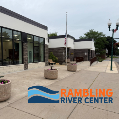 Rambling River Center view from sidewalk with RRC logo on the sidewalk