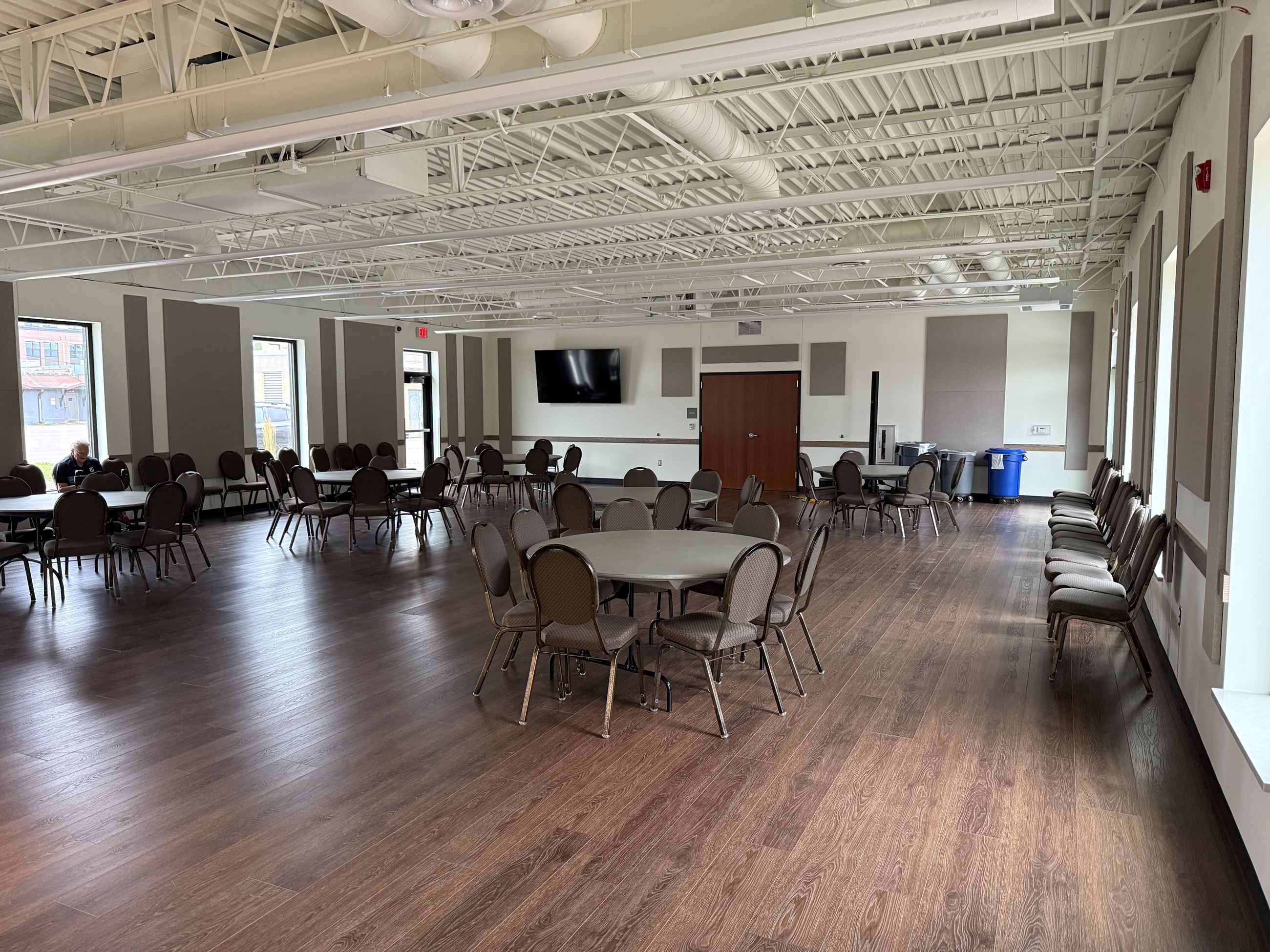 Rambling River Center Banquet Room with lights off and tables and chairs set up