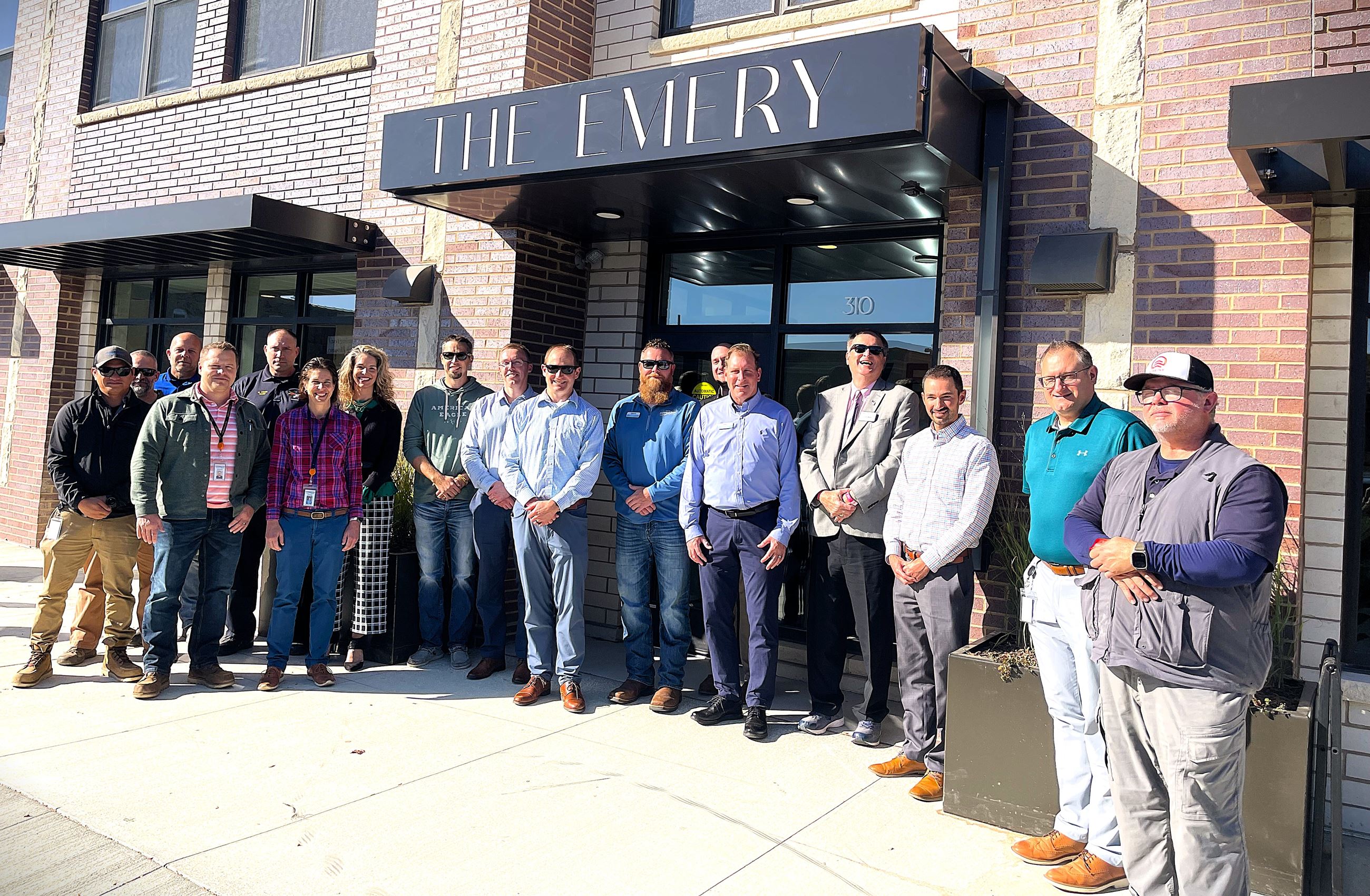 Farmington City Council, Staff and Ebert Construction staff gathered cutting the red ribbon 